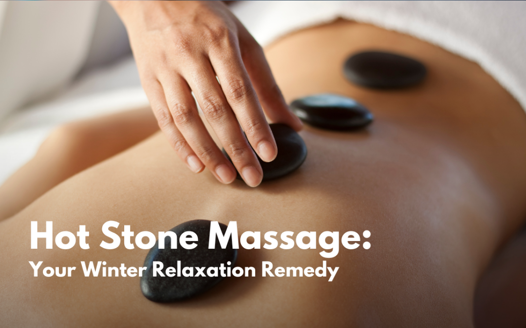 Close-up of a hand gently placing a heated stone on a person's back during a hot stone massage, highlighting relaxation and warmth for the winter season.